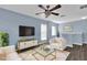 Cozy living room with comfortable seating and ample natural light at 413 Country Cottage Ln, Winter Garden, FL 34787