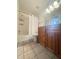 Clean bathroom with a tub, vanity, and wood cabinets at 429 Fountainhead Cir # 122, Kissimmee, FL 34741