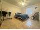 Second bedroom with a single bed and tiled floors at 429 Fountainhead Cir # 122, Kissimmee, FL 34741