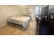 Cozy bedroom with a double bed, dresser, and tiled floors at 429 Fountainhead Cir # 122, Kissimmee, FL 34741