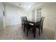 Dining area featuring a dark wood table with four chairs at 429 Fountainhead Cir # 122, Kissimmee, FL 34741