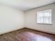 Simple bedroom with hardwood floors and window at 4409 Prairie Ct # A, Orlando, FL 32808