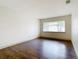 Bedroom with wood floors and large window at 4409 Prairie Ct # A, Orlando, FL 32808