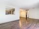 Bright dining room with dark wood floors and kitchen passthrough at 4409 Prairie Ct # A, Orlando, FL 32808