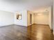 Bright dining room with dark wood floors and kitchen passthrough at 4409 Prairie Ct # A, Orlando, FL 32808