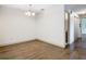 Dining area with wood-look floors and access to hallway at 4409 Prairie Ct # A, Orlando, FL 32808