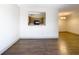 Bright dining room with dark wood floors and kitchen passthrough at 4409 Prairie Ct # A, Orlando, FL 32808