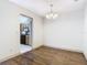 Bright dining room with hardwood floors and view of kitchen at 4409 Prairie Ct # A, Orlando, FL 32808