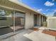 Private patio with sliding glass doors and exterior door at 4409 Prairie Ct # A, Orlando, FL 32808