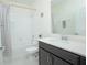 Clean bathroom with tub, shower, and dark vanity at 4708 Tribute Trl, Kissimmee, FL 34746