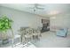 Bright dining area with table and chairs, adjacent to living room at 4708 Tribute Trl, Kissimmee, FL 34746