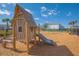 Wooden playhouse with slide at playground at 4708 Tribute Trl, Kissimmee, FL 34746