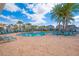 Community swimming pool with lounge chairs at 4708 Tribute Trl, Kissimmee, FL 34746