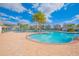 Large community pool with plenty of seating at 4708 Tribute Trl, Kissimmee, FL 34746