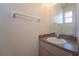 Small bathroom with a sink, mirror, and granite countertop at 4712 Hemingway House St, Kissimmee, FL 34746