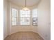 Bright dining area with tiled floor and bay window at 4712 Hemingway House St, Kissimmee, FL 34746