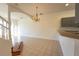 Bright dining room with tiled floors and a chandelier at 4712 Hemingway House St, Kissimmee, FL 34746