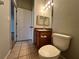 Bathroom with toilet, sink, and wood vanity at 4865 Cypress Woods Dr # 2109, Orlando, FL 32811