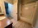 Bathroom with tub, shower, and wood vanity at 4865 Cypress Woods Dr # 2109, Orlando, FL 32811