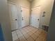 Bright entryway with tile flooring and multiple doors at 4865 Cypress Woods Dr # 2109, Orlando, FL 32811