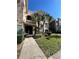 Exterior of two-story condo building with palm trees and walkway at 4865 Cypress Woods Dr # 2109, Orlando, FL 32811