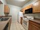 Well-equipped kitchen with ample cabinetry and a double sink at 4865 Cypress Woods Dr # 2109, Orlando, FL 32811