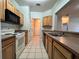 Efficient kitchen boasting wood cabinets and modern appliances at 4865 Cypress Woods Dr # 2109, Orlando, FL 32811