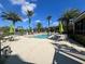 Relaxing community pool area with patio furniture at 4865 Cypress Woods Dr # 2109, Orlando, FL 32811