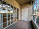 Screened porch with tile floor and access to backyard at 4865 Cypress Woods Dr # 2109, Orlando, FL 32811