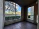 Screened porch with tile floor and view of trees at 4865 Cypress Woods Dr # 2109, Orlando, FL 32811