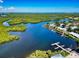 Aerial view showing waterfront condos and boat docks with beautiful waterway views at 5 Riverwalk Dr # 301, New Smyrna Beach, FL 32169