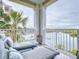 Relaxing balcony with lounge furniture offering scenic water views and a glimpse of the community at 5 Riverwalk Dr # 301, New Smyrna Beach, FL 32169