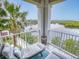 Inviting balcony with lounge furniture offering serene water views at 5 Riverwalk Dr # 301, New Smyrna Beach, FL 32169