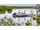 Beautiful view of boats docked on a serene river or lake at 5 Riverwalk Dr # 301, New Smyrna Beach, FL 32169