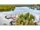 Scenic view of private boat dock with access to open water and mangroves at 5 Riverwalk Dr # 301, New Smyrna Beach, FL 32169