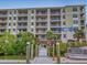 Waterfront condo building with boat docks and private balconies at 5 Riverwalk Dr # 301, New Smyrna Beach, FL 32169