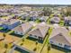 Aerial view of neighborhood with houses and streets at 5372 Palomino Pl, Apopka, FL 32712