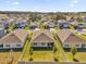 Aerial view of homes with green lawns and trees at 5372 Palomino Pl, Apopka, FL 32712