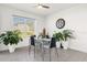 Bright dining area with glass table and seating for four at 5372 Palomino Pl, Apopka, FL 32712