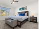 Large main bedroom with a king bed and seating at 5372 Palomino Pl, Apopka, FL 32712