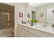 Bathroom with double vanity and shower/tub combo at 5452 Misty Oak Cir, Davenport, FL 33837