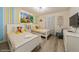 bedroom with twin beds and Disney character bedding at 5452 Misty Oak Cir, Davenport, FL 33837