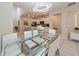 Bright dining room with glass table and modern chandelier at 5452 Misty Oak Cir, Davenport, FL 33837