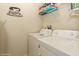 Convenient laundry room with washer, dryer, and shelving at 5452 Misty Oak Cir, Davenport, FL 33837