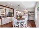 Bright dining room features hardwood floors and a rustic wooden table at 646 Palm Dr, Oviedo, FL 32765