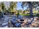 Fire pit and seating area in a backyard setting at 646 Palm Dr, Oviedo, FL 32765