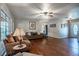 Living room with hardwood floors, couch and large windows at 646 Palm Dr, Oviedo, FL 32765