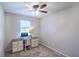 Bright home office features built-in desk and ceiling fan at 646 Palm Dr, Oviedo, FL 32765