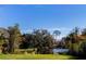 Serene pond view with a wooden dock at 646 Palm Dr, Oviedo, FL 32765