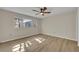 Spacious bedroom with light walls, wood flooring, and ceiling fan at 700 Melrose Ave # A 22, Winter Park, FL 32789